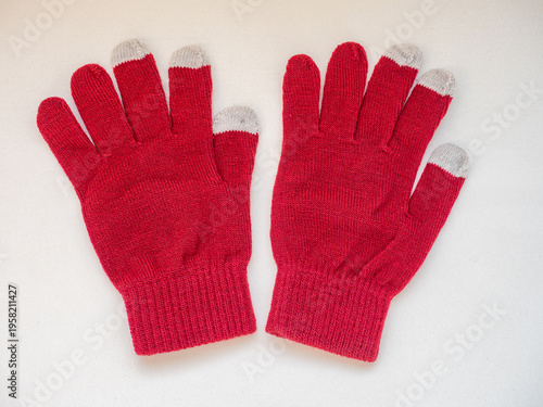 Top view of white cotton knitted gloves isolated on white