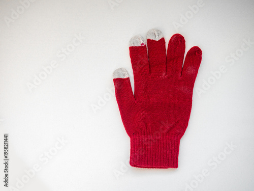 Top view of white cotton knitted gloves isolated on white