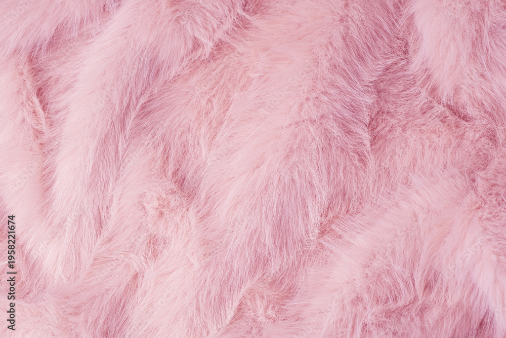 Fototapeta premium Soft pink fluffy fabric textile background with beautiful textured waves and delicate pattern