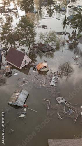 A spring large-scale flood disaster with fully submerged houses, flooded roads,and overflowing waterways. The footage shows the dramatic impact of heavy rainfall and rising water levels on residential