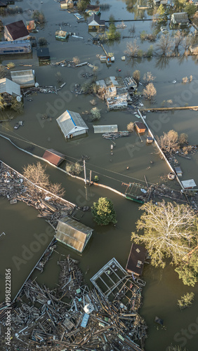 A spring large-scale flood disaster with fully submerged houses, flooded roads,and overflowing waterways. The footage shows the dramatic impact of heavy rainfall and rising water levels on residential