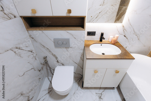 Minimalist Sanitary Space With Refined Marble Finishes And Warm Wooden Countertop Design