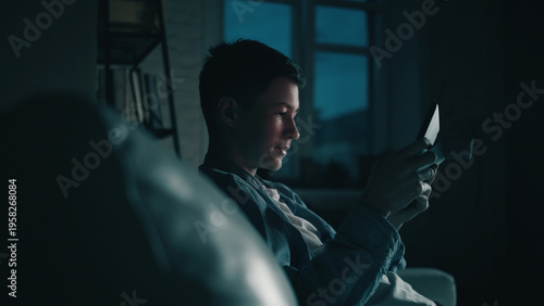 Man Reading Book Late at Night on Couch, have fun and enjoy