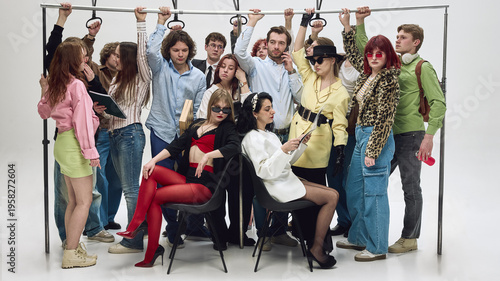 Crowded group of people holding handrails standing tightly in subway carriage. Concept of rush hour commute, urban transport pressure, overcrowding problem, and daily city life.