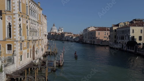 Slow motion gondola gliding through peaceful Venice canal