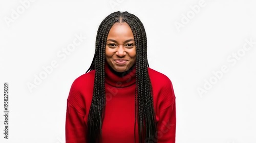 A young woman with braids celebrating and expressing joy