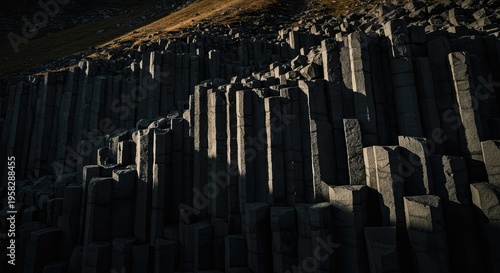 Dramatic Basalt Columns: Striking Light and Shadow on Natural Formation.