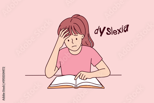 Obraz na plátně Small girl with dyslexia holding her head while struggling to read a book