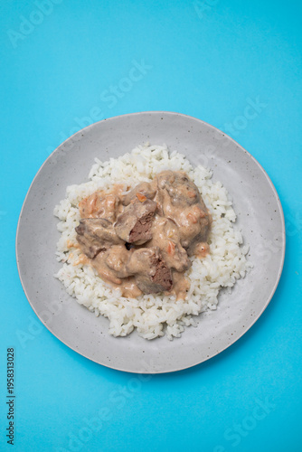 Fried chicken liver with boiled rice on dish