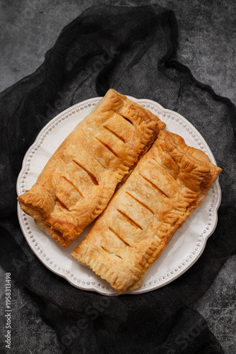 puff pastry with jam on white plate