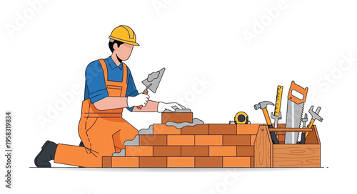 Construction worker building brick wall with tools.