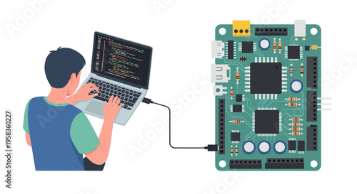 Programmer coding on laptop connected to electronic circuit board.