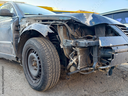 Obraz na płótnie A road accident left the passenger car in a severe wrecked condition