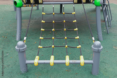 Gray frame holds yellow-tied climbing net