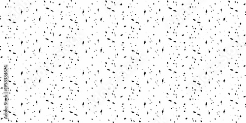 Dense scattering of small irregular black shapes on a white background