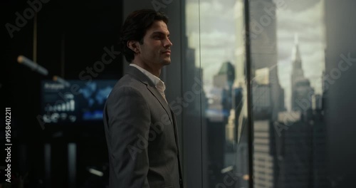 White Businessman in a Gray Suit Stands in a Modern Office, Thinking Through Startup Strategy and Finance Goals With a Slight Smile, Embodying Entrepreneurship, Economics, Leadership and Success