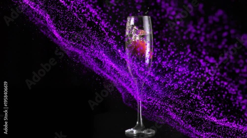Strawberry descending in flute piercing liquid, bubbling purple specks sweeping glass to show flute