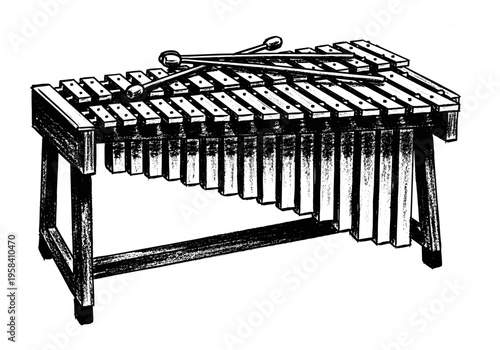 Black and white illustration of a xylophone with mallets resting on top