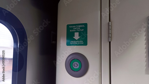 View of the button to open the train carriage door