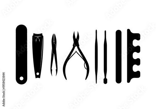 Collection of black manicure and pedicure tools arranged in a line