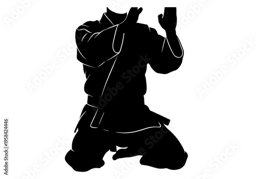 Martial arts practitioner in traditional uniform performing a defensive stance on knees