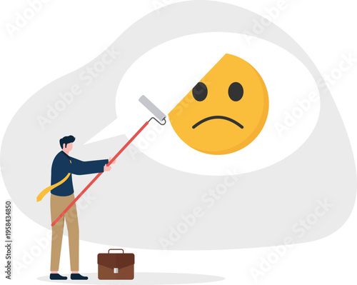 Businessman using a squeegee to wipe away a sad emoticon for positive change