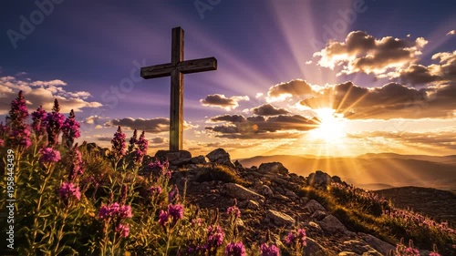Wooden cross with purple flowers at sunset