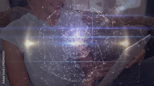 Animation of globe of network of connections over schoolboy writing