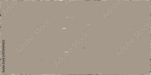 Fotografie A muted textured taupe background with scattered white specks