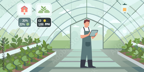 A man monitors greenhouse conditions using a tablet and environmental sensors