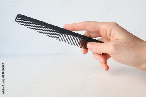 Photo taken in Poland, Krakow, March, hair and beard trimmer, personal care and hygiene, stylish hairstyle, home appliances, comb in hand, hairdresser,