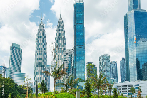 Photography Kuala Lumpur skyline with high rise buildings, green tropical park, twin towers and modern skyscrapers in central business district, Malaysia