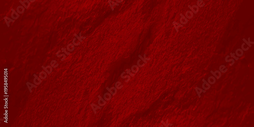 Deep red textured wall background with organic rough plaster surface and soft shadows