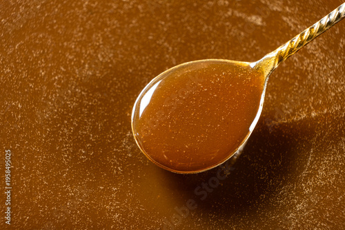 Wallpaper Mural Spoonful of delicious homemade golden caramel dip Torontodigital.ca