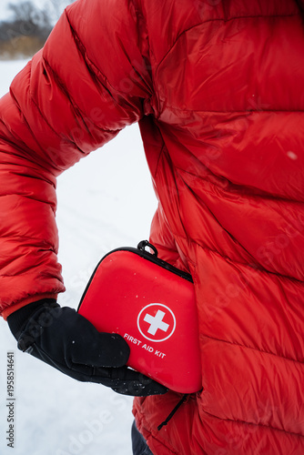 Quick Reach First Aid Container. First Aid Kit Positioned For Emergency Accessibility. Emergency Medical Kit Conveniently Placed At Hip Height For Rapid Response In Outdoor Settings