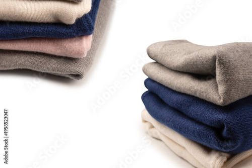 A group of warm sweaters isolated on a white background.