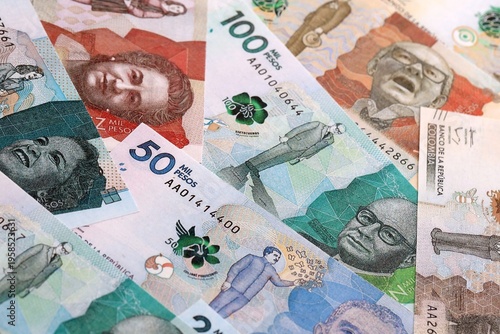 Wallpaper Mural Colombian peso money bills pile on table. Colombia banknotes of COP currency close up. Torontodigital.ca