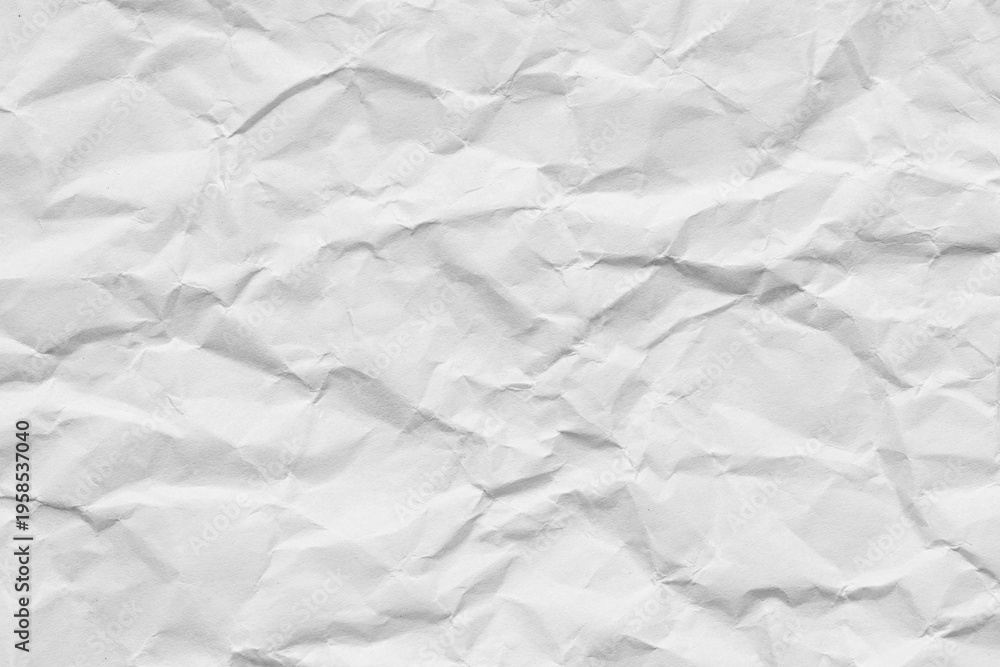 Fototapeta premium White Crumpled Paper Texture Background,Top view of a blank white sheet of crumpled paper. The surface is covered in random folds, creases, and wrinkles, creating a high-contrast textured background. 