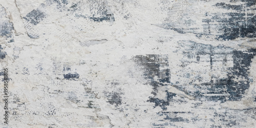 A grunge wall texture features a cold winter pattern of frost and ice over a blue marble stone surface to create a gray frozen nature backdrop