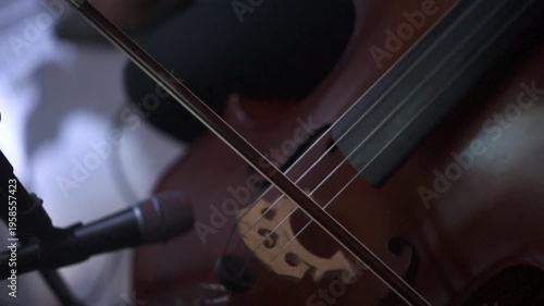 Close up of Musician Playing Cello with Bow in Orchestral Performance