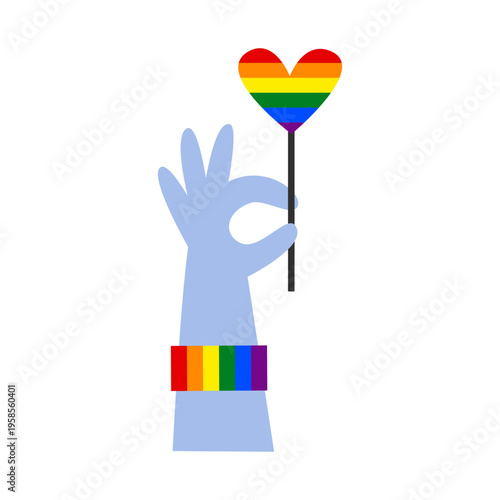Hand holds a lollypop rainbow heart. Concept of love, acceptance, and inclusivity in the LGBT community. Symbol of peace, support, and connection.