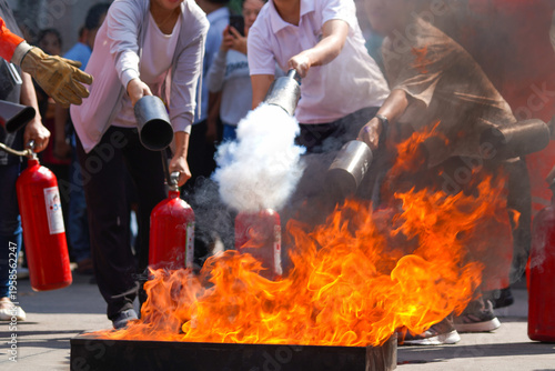 Obraz na plátně Employees firefighting training, Concept Employees hand using fire extinguisher