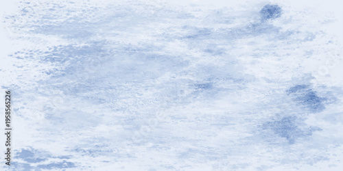 Beautiful fluffy white clouds float across a clear blue summer sky creating a natural and beautiful cloudscape in the bright sunny atmosphere