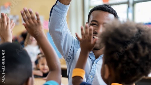 Happy elementary school teacher engaging with students while giving high fives in a bright classroom during a fun learning activity in the morning