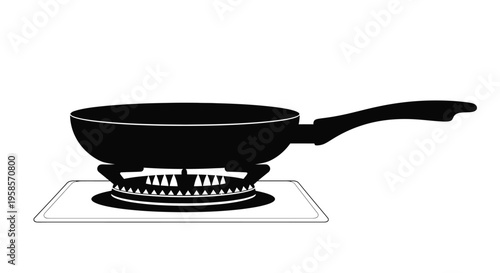 A black frying pan on a stovetop burner stark silhouette