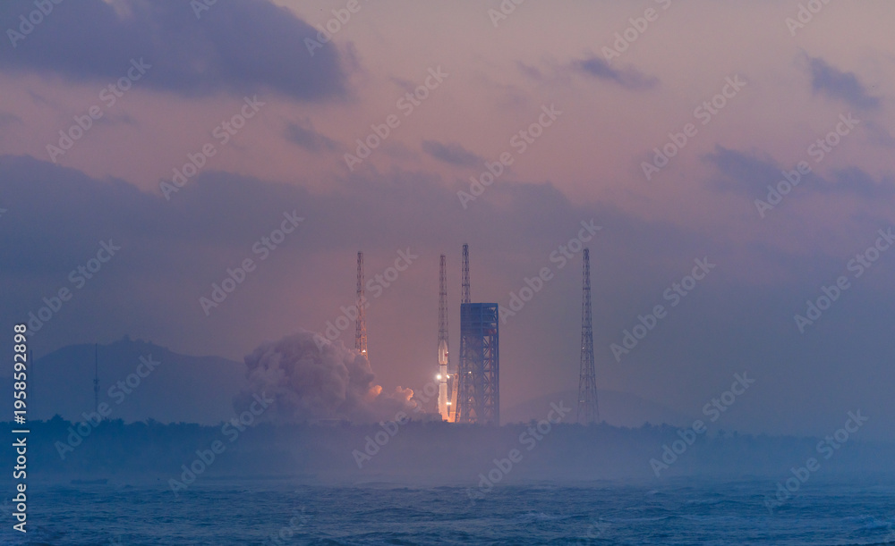 Fototapeta premium Rocket launch at dawn with smoky cloud trail and soft horizon. Launcher with space shuttle in Wenchang Hainan, aerospace program of China.