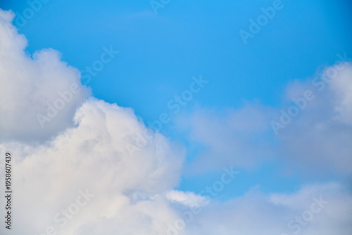 Close-up of blue sky with huge white clouds