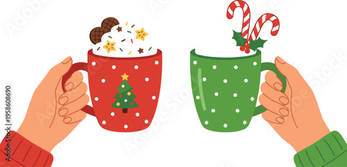 Two hands holding festive red and green polka dot mugs filled with hot cocoa whipped cream candy canes and holiday sprinkles for winter celebration