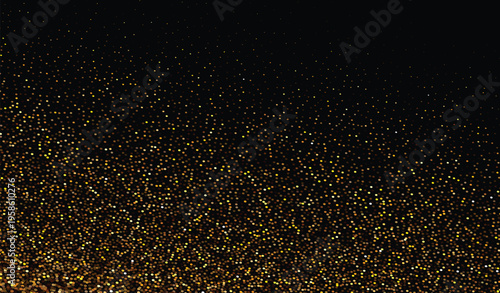 Golden glitter dust falling on black background