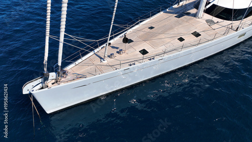 Aerial drone photo of beautiful sail boat anchored in deep blue Aegean Sea